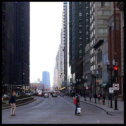 Morning light on downtowm Chicago, Illinois, as traffic from both people and cars make their way in the city. Red stop lights and vehicle brake lights bring this photograph an atmosphere of the motion of city life.

Fine art photography of by Frank J Casella.